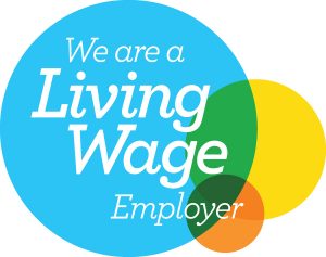 The Living Wage logo. Three coloured circles with 'We are a Living Wage Employer' in the middle.
