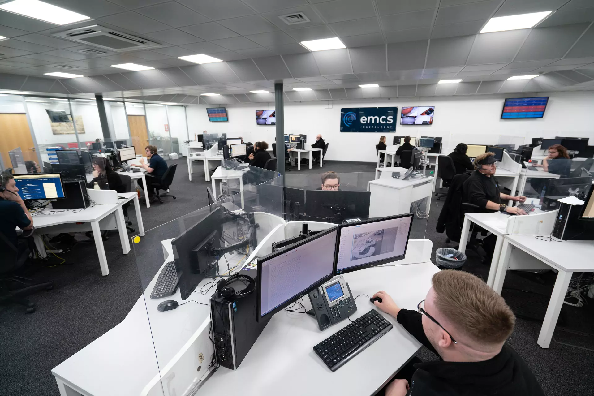 A busy central control room in a security centre.