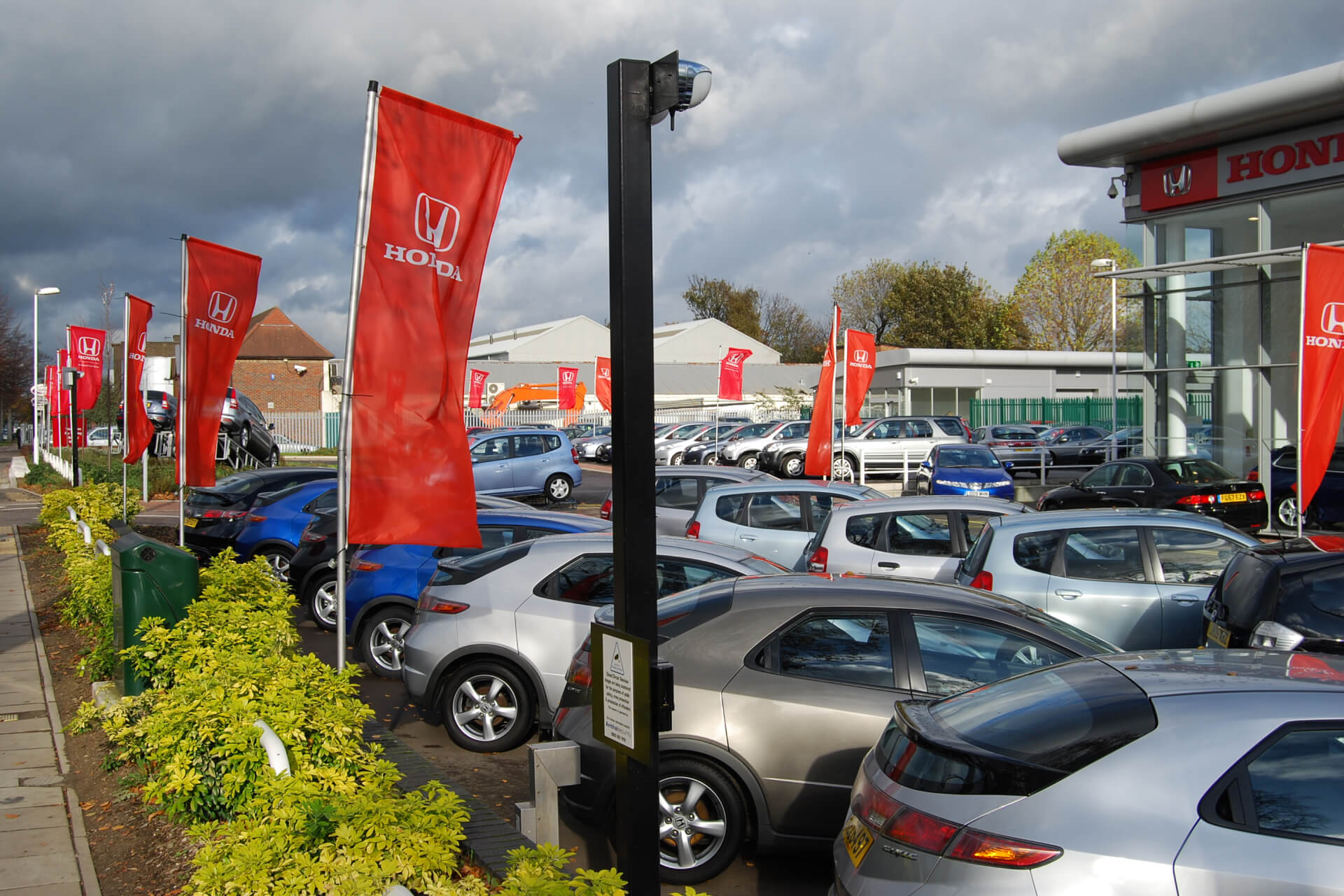 A Honda dealership forecourt with cars for sale.